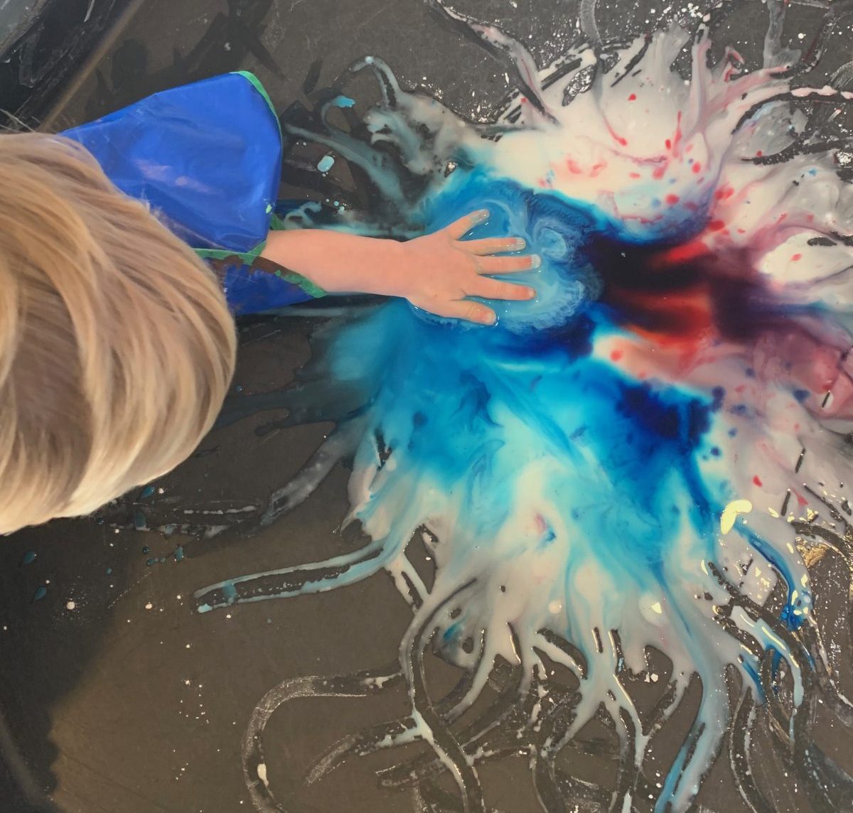 Children playing with coloured cornflour